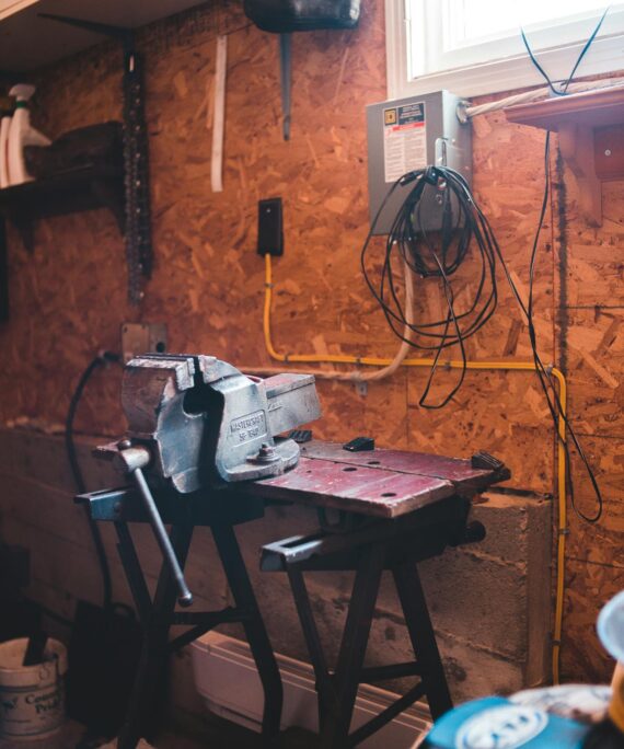 Steel machine in modern messy workshop